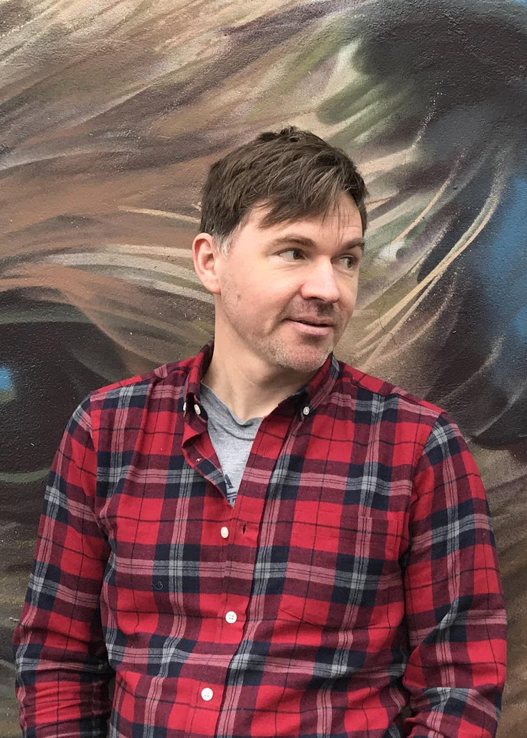 Portrait of Allan Frater, wearing a red flannel shirt